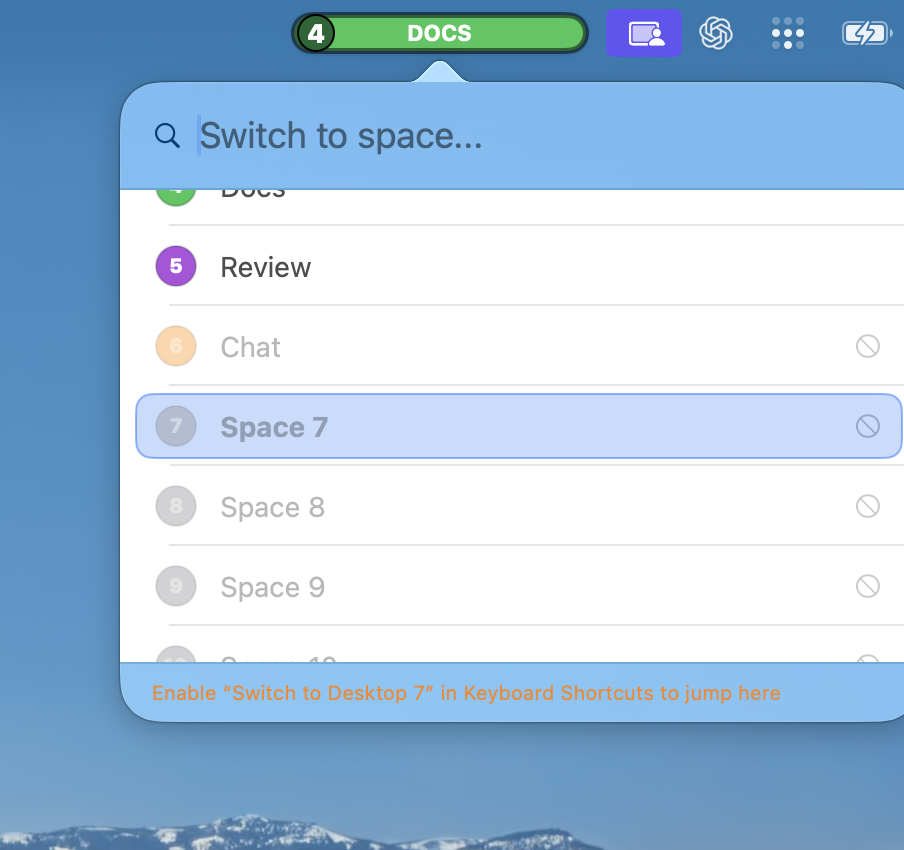 The Quick Switch panel with Space 7 selected but greyed out and marked with a no-entry symbol; the footer reads: Enable 'Switch to Desktop 7' in Keyboard Shortcuts to jump here